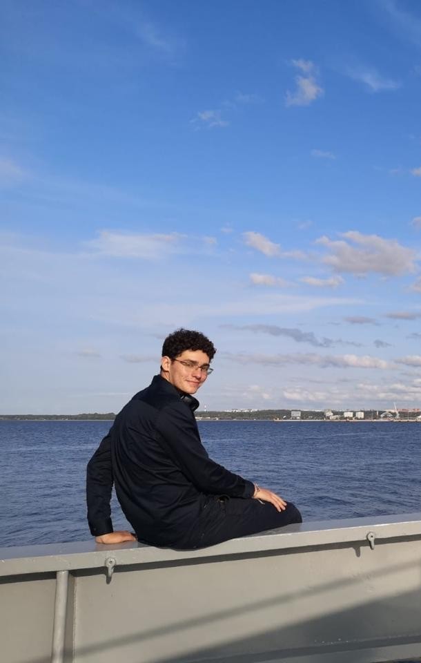 Team collaborating around a laptop